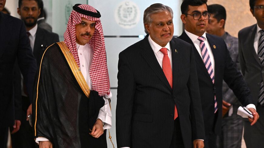 Saudi Foreign Minister Prince Faisal bin Farhan (L) and his Pakistan's counterpart Ishaq Dar arrive to address a joint press conference at the foreign ministry in Islamabad on April 16, 2024. 