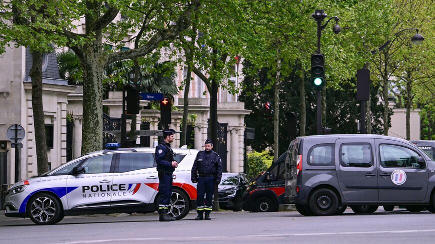 French police officers take part in a security perimeter near the Iranian Consulate in Paris after a person was suspected of entering the building with explosives, April 19, 2024.