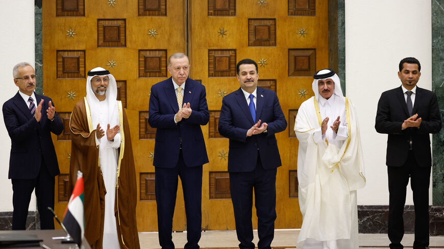 (L to R) Turkey's Transport Minister Abdulkadir Uraloglu, UAE's Energy Minister Suhail Mohamed al-Mazrouei, Turkey's President Recep Tayyip Erdogan, Iraq's Prime Minister Mohammed Shia al-Sudani, Qatar's Minister of Transport Jassim bin Saif bin Ahmed al-Sulaiti, and Iraq's Transport Minister Razzaq Muhaibas al-Saadawi applaud during their meeting for the signing of the "Development Road" framework agreement on security, economy, and development in Baghdad on April 22, 2024. (Photo by Thaier Al-Sudani / POO
