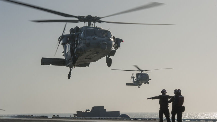 This US Navy photo released Jan. 15, 2015 shows an MH-60S Sea Hawk helicopter from the Red Lions of Helicopter Sea Combat Squadron (HSC) 15 as it prepares to land on the flight deck of the Nimitz-class aircraft carrier USS Carl Vinson (CVN 70) on Jan. 13, 2015 in the Gulf. 