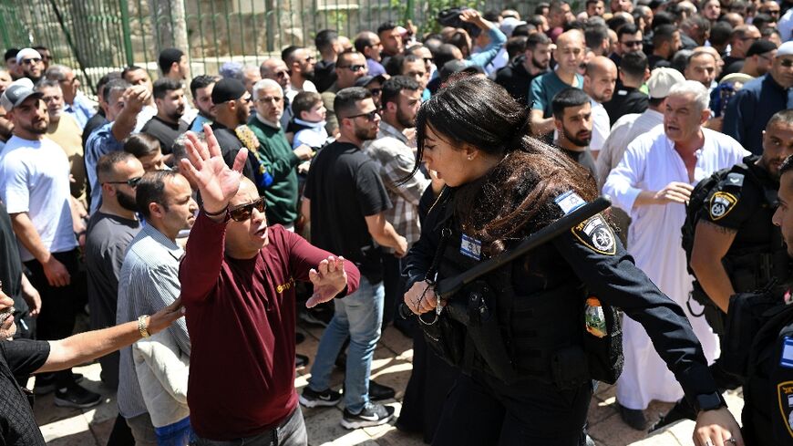 Israeli police push back Palestinians close to the entrance of Jerusalem's Al-Aqsa mosque 