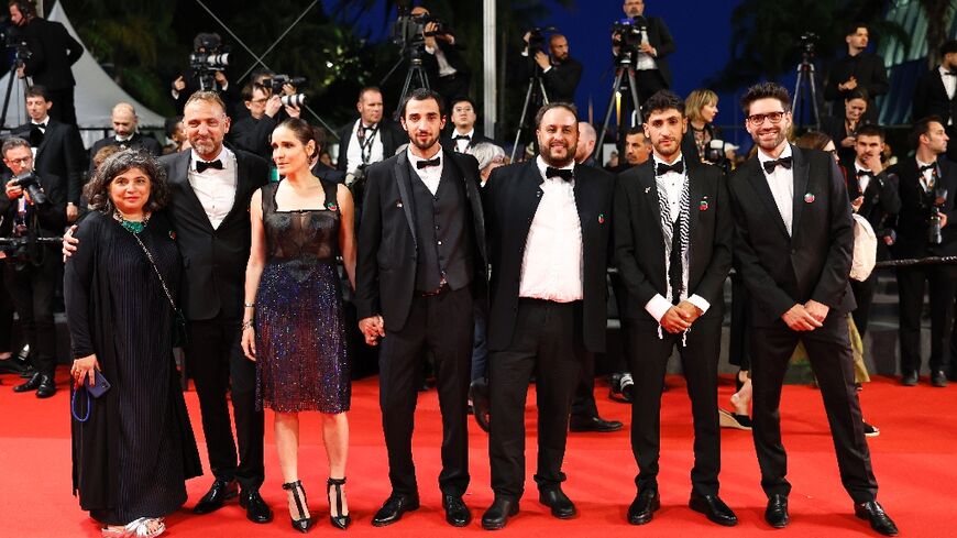 Palestinian-Danish director Mahdi Fleifel (third right) brought actors Mahmood Bakri (centre) and Aram Sabbagh (second right) to Cannes