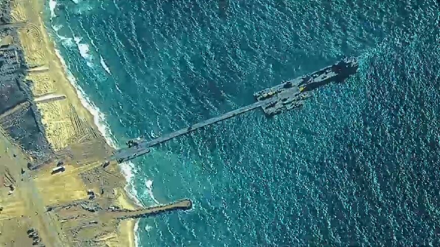 A US military picture taken on May 16, 2024 shows the temporary pier attached to the Gaza coast