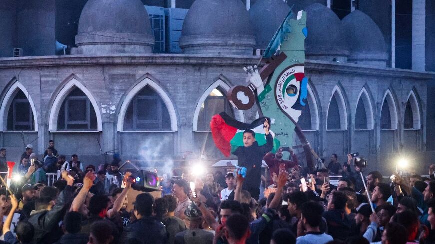 Gazans celebrated in the streets of Rafah after Hamas said it agreed to a truce proposal from Qatar and Egypt to pause the war with Israel