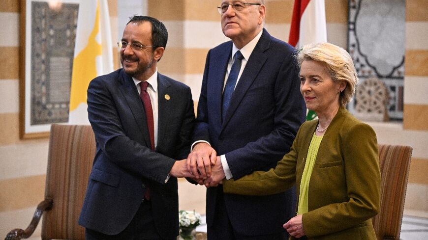 Lebanon's Prime Minister Najib Mikati (C) poses for a picture with European Commission President Ursula von der Leyen and Cypriot President Nikos Christodoulides in Beirut on May 2, 2024