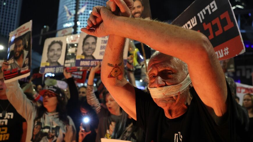 Relatives and supporters of hostages seized by Gaza militants during the October 7 attacks rally in Tel Aviv for their release