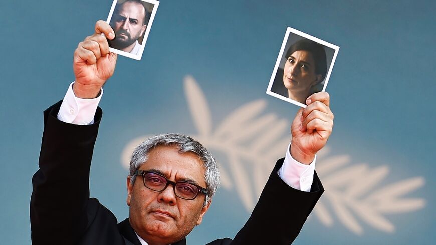 Rasoulof held up pictures of his actors Soheila Golestani  and Missagh Zareh at the premiere