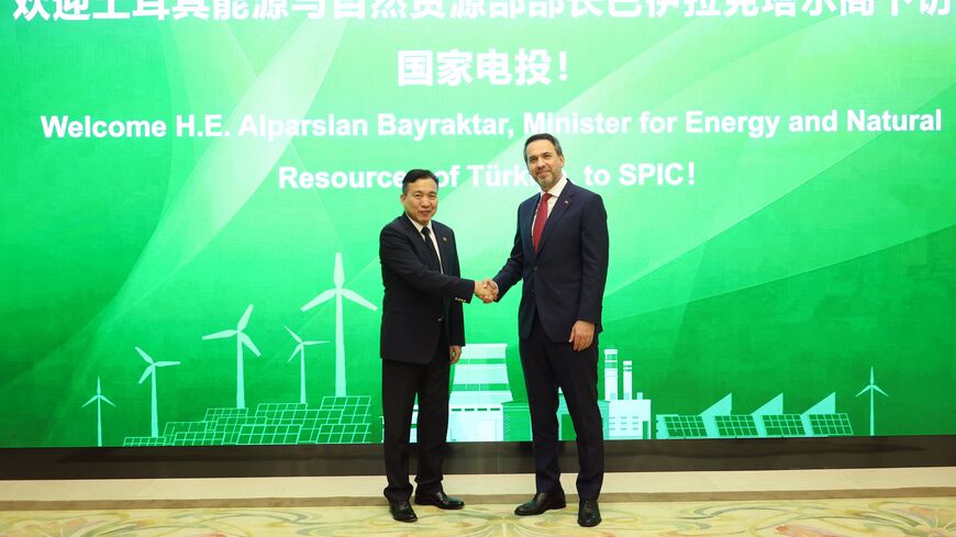  Turkish Energy Minister Alparslan Bayraktar and the head of China's National Energy Administration in Beijing on May 22, 2024. 