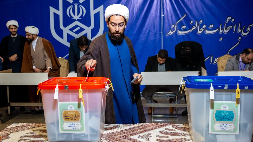 Iranians participate in the 12th term parliamentary elections and the 6th term Assembly of Leadership Experts' voting at a Tehran polling station on March 1, 2024. 