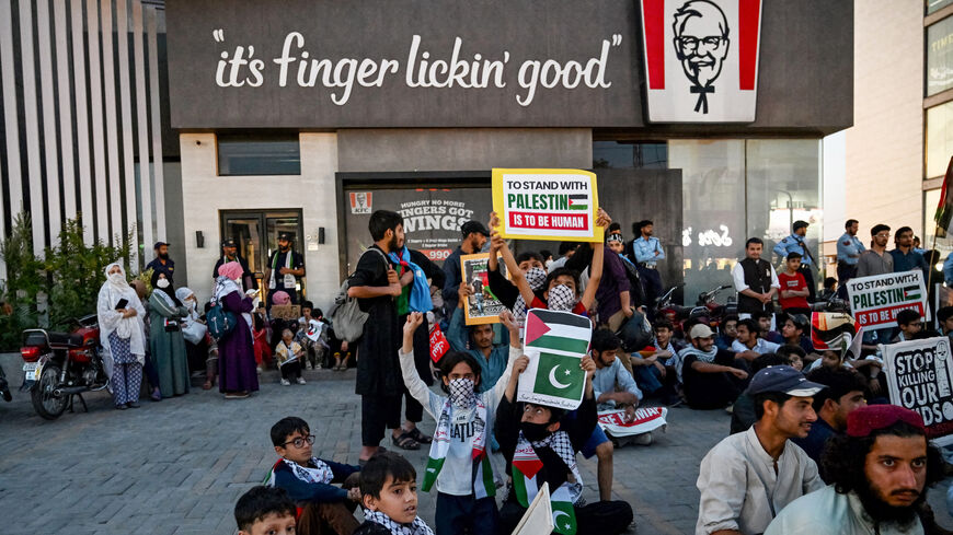 Supporters of Islami Jamiat-e-Talaba (IJT), a student wing of Pakistan's Jamaat-e-Islami (JI) party stage a pro-Palestinian protest outside a Kentucky Fried Chicken (KFC) restaurant calling for boycott of Israeli products on the outskirts of Islamabad on May 7, 2024, amid the ongoing war between Israel and the militant Hamas group in the Gaza Strip. (Photo by Farooq NAEEM / AFP) (Photo by FAROOQ NAEEM/AFP via Getty Images)
