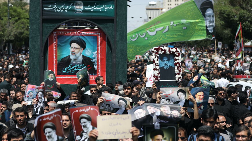 Iranian mourners attend the funeral of late president Ebrahim Raisi in the city of Mashhad on May 23, 2024.