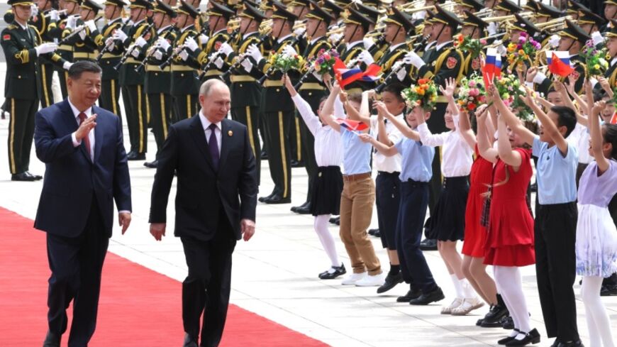 A military band welcomed the President with the Russian national anthem, and the Russian tricolor was hoisted over Tiananmen Square.