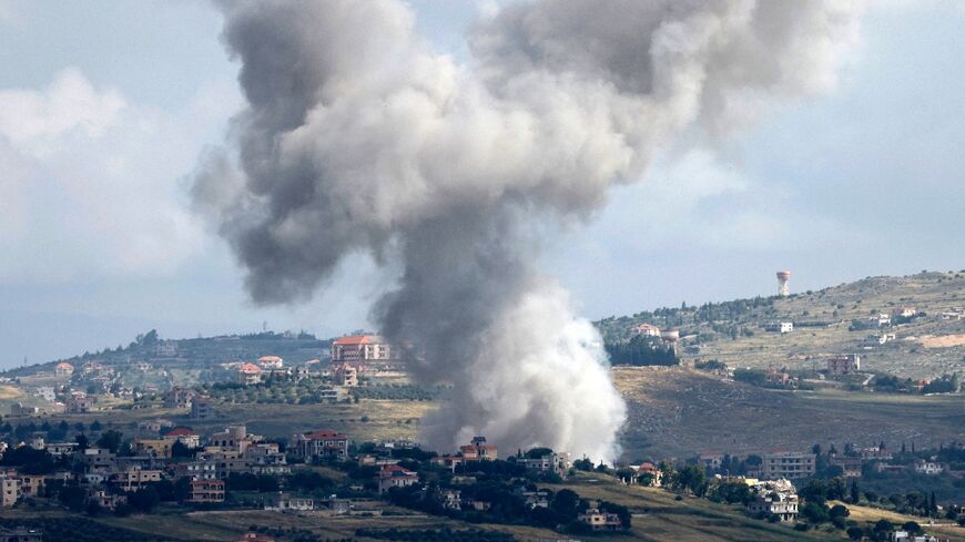Seen from northern Israel, smoke billows above the Lebanese village of Mays al-Jabal during Israeli bombardment 