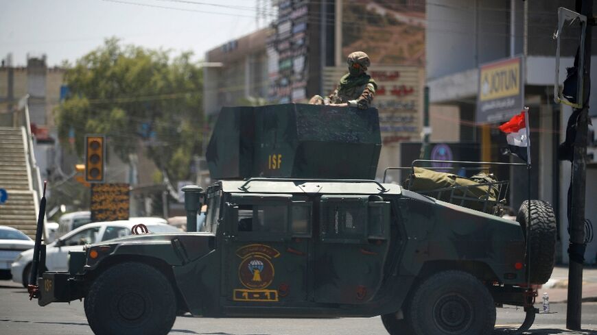 Iraqi security forces secure Baghdad's Palestine Street a day after dozens of men attacked two US-linked restaurants on the thoroughfare, one of them a KFC