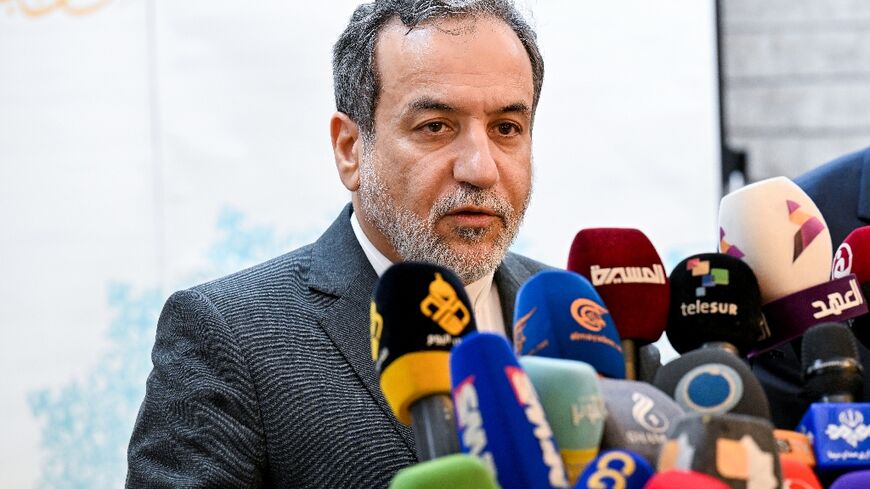 Iranian Foreign Minister Abbas Araghchi speaks to reporters at Tehran's embassy in Damascus