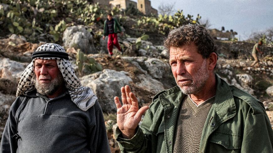 Palestinian prisoner Nael Barghouthi (R), seen here in 2013, is set to be deported after his release as part of a Gaza ceasefire deal