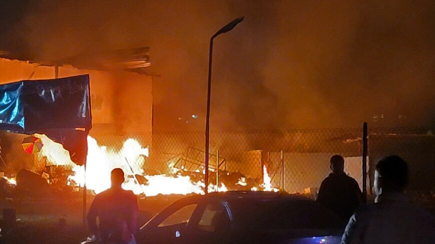Rescuers rush to the site of an Israeli airstrike that targeted an area in the southern Lebanese village of Nabatiyeh al-Fawqa