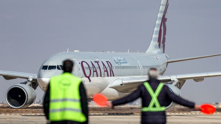 An Australian couple have criticised Qatar Airways after a blanket-draped corpse was seated next to them during a long-haul flight