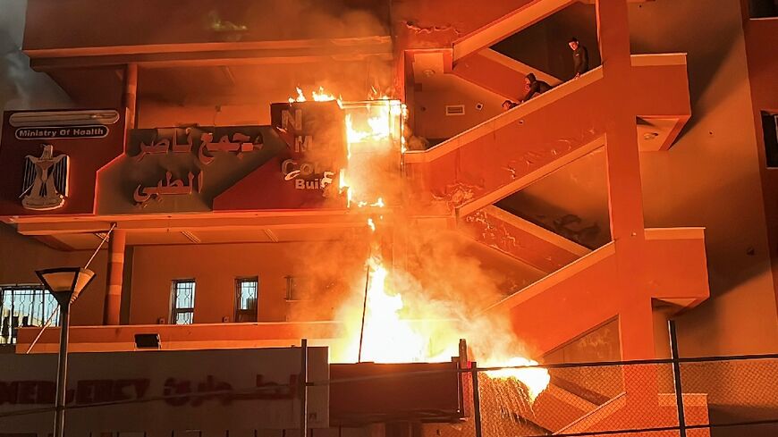 Fire burns at the emergency department of Nasser Hospital in Khan Yunis, southern Gaza, after an Israeli air strike