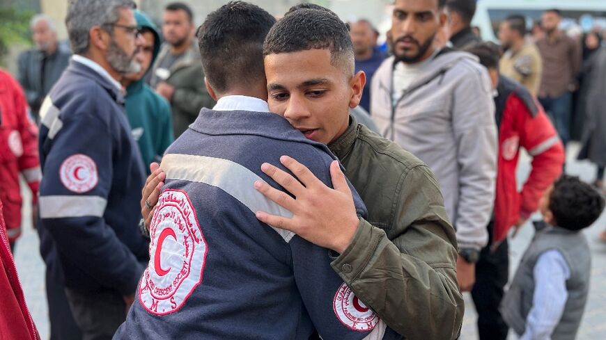 Gazans outside a hospital in the territory's south after the Red Crescent announced the deaths of formerly missing rescuers