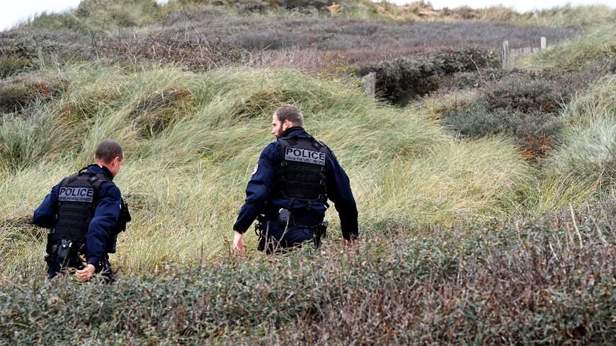 Police patrol Wimereux beach, northern France, in November 2021 after the drowning tragedy