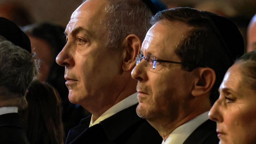 Israel's President Isaac Herzog and Prime Minister Benjamin Netanyahu attend a ceremony marking Yom HaShoah, Holocaust Remembrance Day