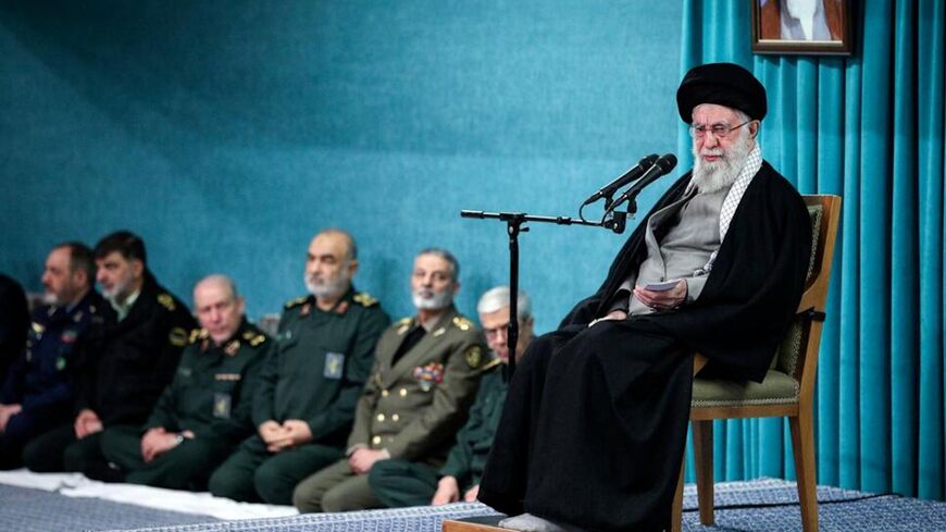 Supreme Leader Ayatollah Ali Khamenei speaks as armed forces commander listen, at rear, in a ceremony meeting a group of officials in Tehran, on March 8, 2025. 