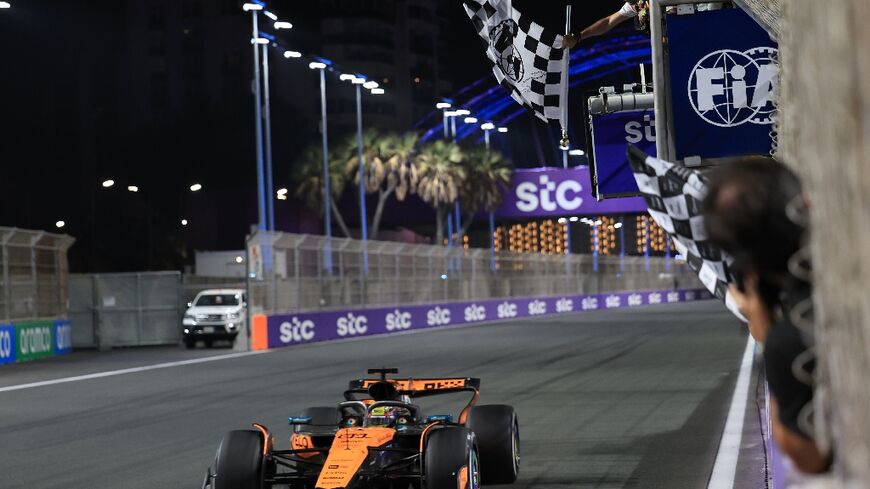 McLaren's Oscar Piastri takes the chequered flag to win the Saudi Arabia Grand Prix 