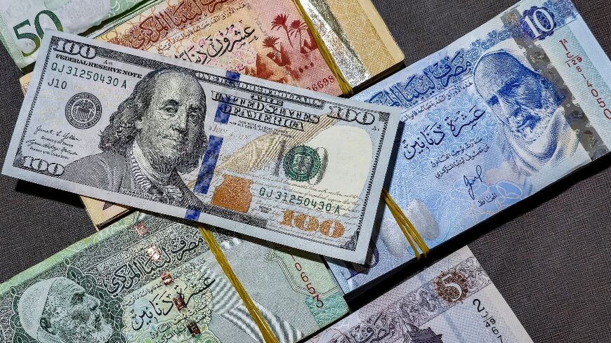 The Libyan central bank earlier this month devalued the dinar by 13.3 percent, the second such move in five years