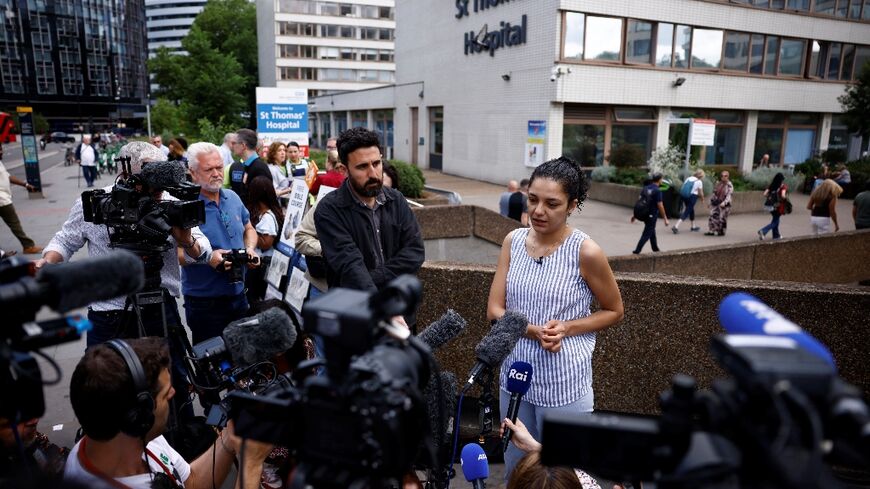 Sanaa Seif, sister of jailed activist Alaa Abdel Fattah, speaking to reporters outisde the London hospital where her mother was admitted amid her hunger strike