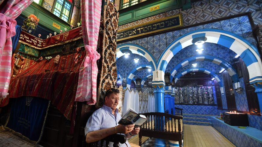 A French Jewish man prays inside the historic Ghriba synagogue on the Tunisian island of Djerba