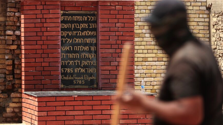 Iraqi workers restore the shrine of the the 10th century Jewish Rabbi Isaac Gaon in central Baghdad's al-Kifah neighborhood