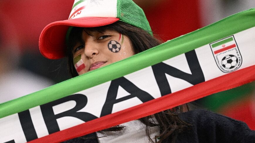 An Iran fan supports her team at a game against the US side at the Qatar 2022 World Cup