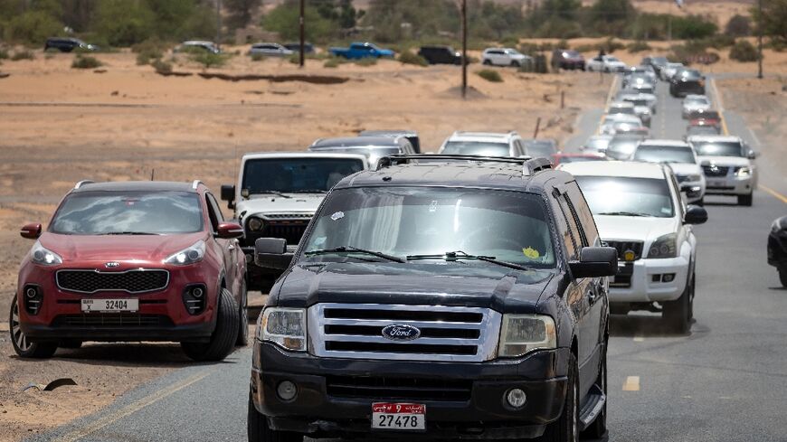 Indian-born UAE estate agent Muhammed Sajjad, leads a convoy of fIndian expats nostalgic for the monsoon season, on a "rain chase" into the Emirati desert from coastal Sharjah.