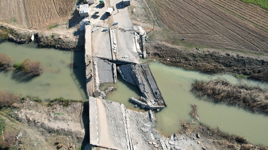 An aerial view shows a bridge, destroyed in an Israeli airstrike, in the town of in Qusayr in Syria's central Homs province on December 14, 2024. Islamist-led rebels took Damascus in a lightning offensive on December 8, ousting president Bashar al-Assad and ending five decades of Baath rule in Syria. (Photo by AAREF WATAD / AFP) (Photo by AAREF WATAD/AFP via Getty Images)