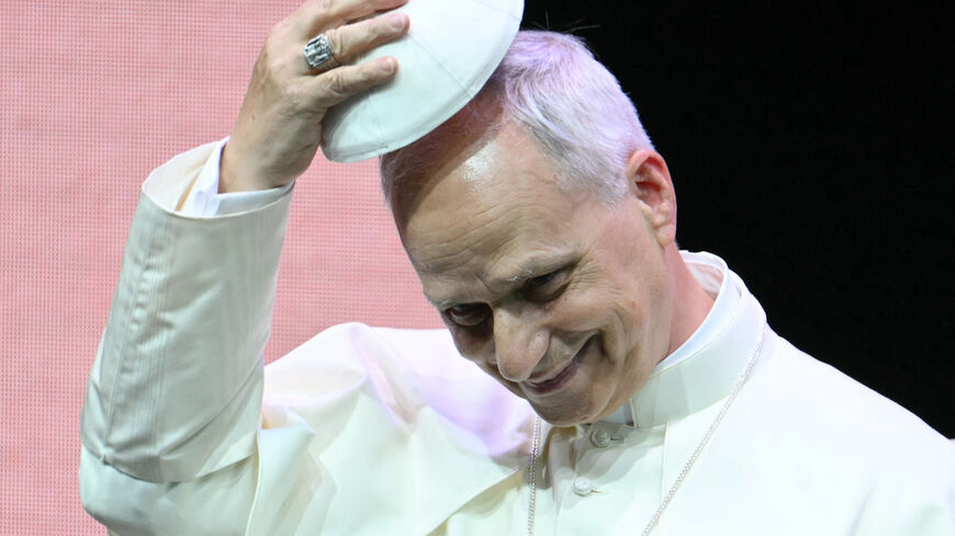 Pope Leo XIV exchanges skullcap (zucchetto) during an audience to the participants in the Meeting of Priests promoted by the Dicastery for the Clergy at the auditorium Conciliazione in Rome on June 26, 2025. (Photo by Alberto PIZZOLI / AFP) (Photo by ALBERTO PIZZOLI/AFP via Getty Images)