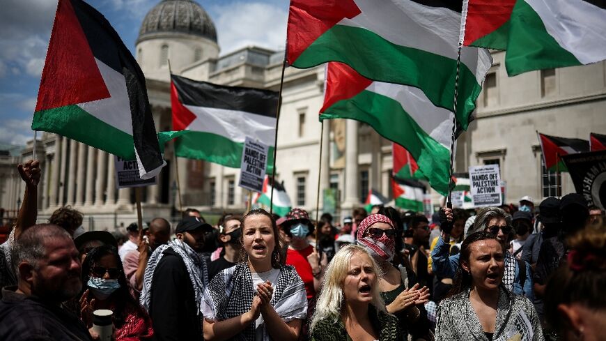 Supporters of Palestine Action protest at Trafalgar Square in London as Britain moves to ban the group