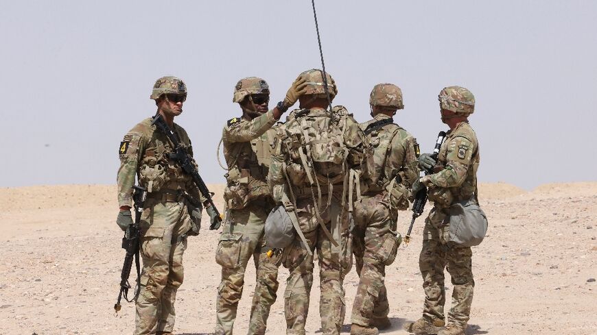 US military personnel participate in a Best Squad Competition at the Buehring base in Udairi, in Kuwait, on May 10, 2023