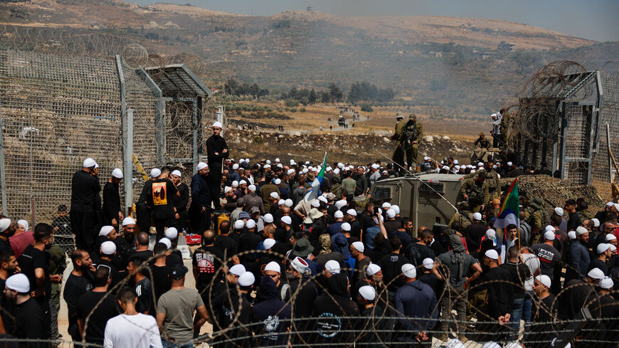 Israeli Druze cross the border to check on their family members in Syria, amid the ongoing conflict in the Druze areas in Syria,  in Majdal Shams, near the ceasefire line between the Israeli-occupied Golan Heights and Syria, July 16, 2025. REUTERS/Ammar Awad