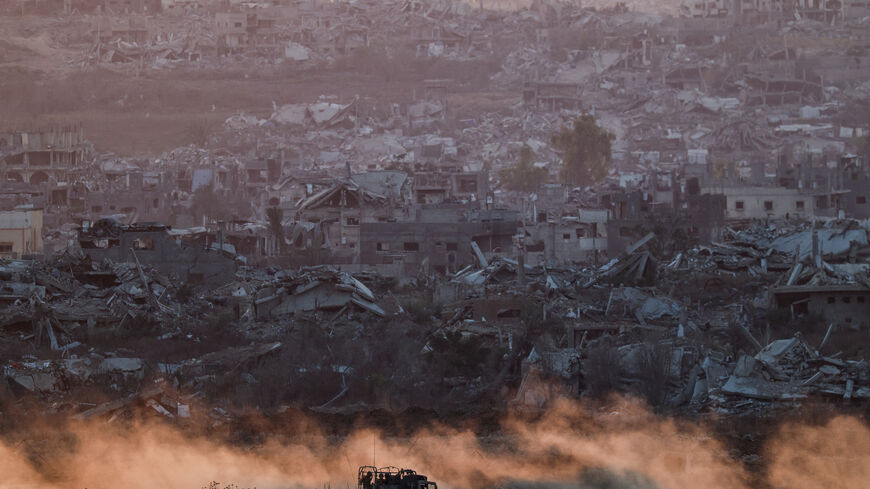 FILE PHOTO: An Israeli military vehicle manoeuvres in Gaza, as seen from the Israeli side of the Israel-Gaza border, July 16, 2025. REUTERS/Amir Cohen/File Photo