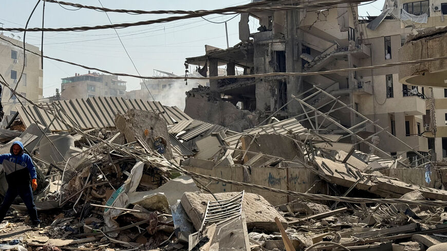 A man stands next to rubble at a damaged site in the aftermath of Israeli strikes, in Beirut's southern suburbs, Lebanon June 6, 2025. REUTERS/Ali Hankir/File Photo