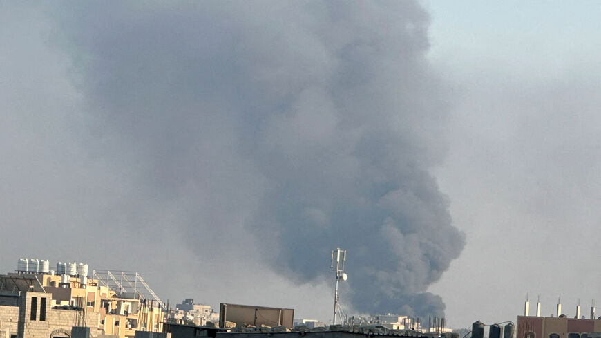 Smoke rises during Israeli strikes amid the Israeli military operation in Deir Al-Balah, in the central Gaza Strip, July 21, 2025. REUTERS/Hatem Khaled/File Photo