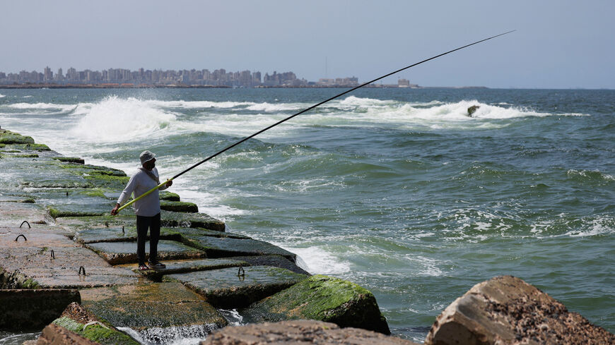 FILE PHOTO: A view shows an Alexandrian citizen fishing on the corniche in the Mediterranean city of Alexandria, Egypt, April 20, 2025. REUTERS/Mohamed Abd El Ghany/File Photo