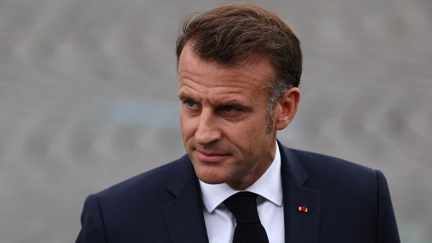 FILE PHOTO: French President Emmanuel Macron reviews troops during the annual Bastille Day military ceremony on the Place de la Concorde in Paris, France, July 14, 2025. REUTERS/Gonzalo Fuentes/File Photo