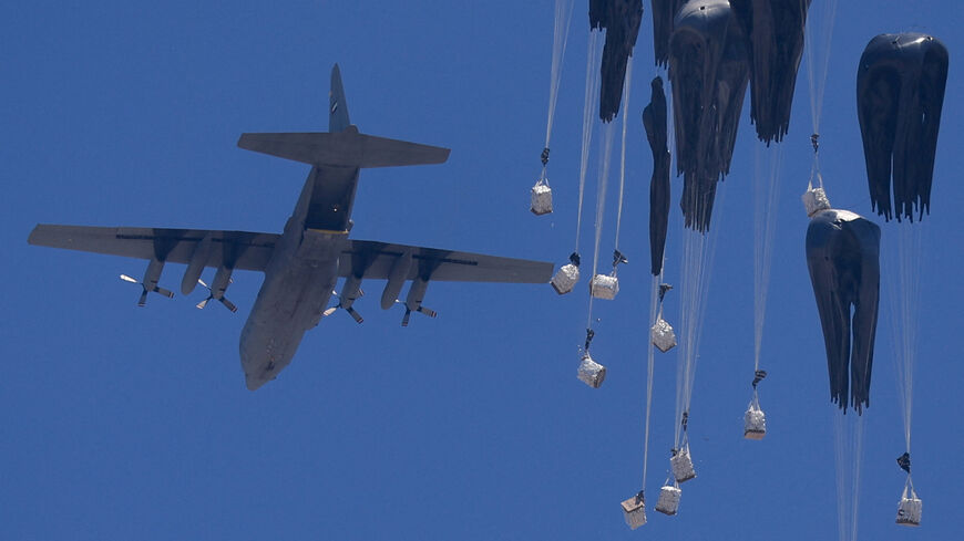 An airplane drops humanitarian aid over Gaza as seen from northern Gaza Strip July 27, 2025. REUTERS/Dawoud Abu Alkas