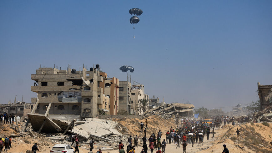 Humanitarian aid is airdropped over Gaza as seen from northern Gaza Strip July 27, 2025. REUTERS/Dawoud Abu Alkas