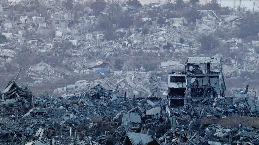 Destroyed buildings lie in Gaza, as seen from the Israeli side of the border,  July 28, 2025. REUTERS/Amir Cohen