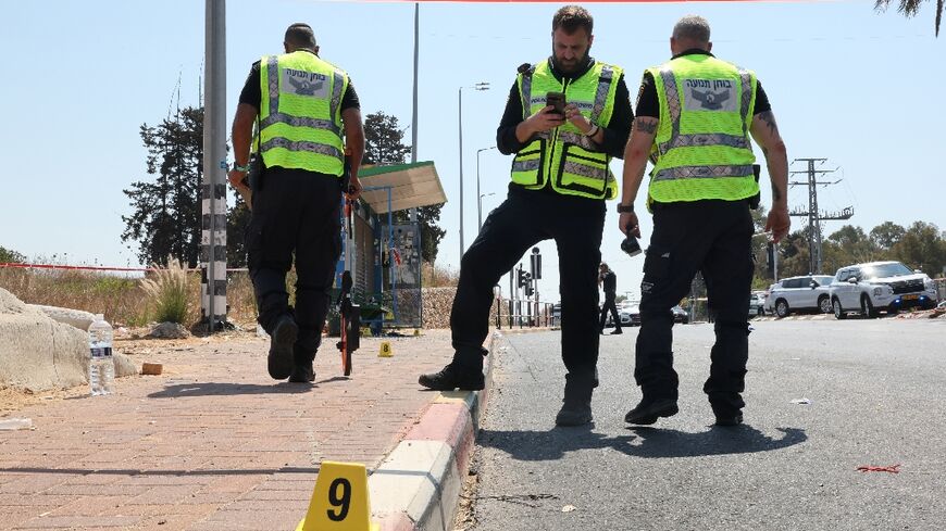 Israeli police cordon off the site of a suspected car ramming attack near the central town of Kfar Yona.