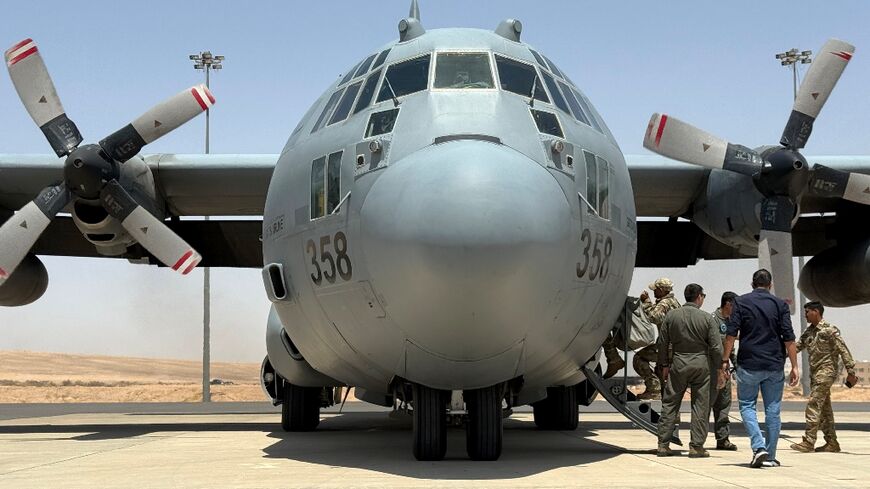 A Royal Jordanian Air Force C-130 Hercules military transport prepares to take off from King Abdullah II airbase with a consignment of aid to airdrop over Gaza.