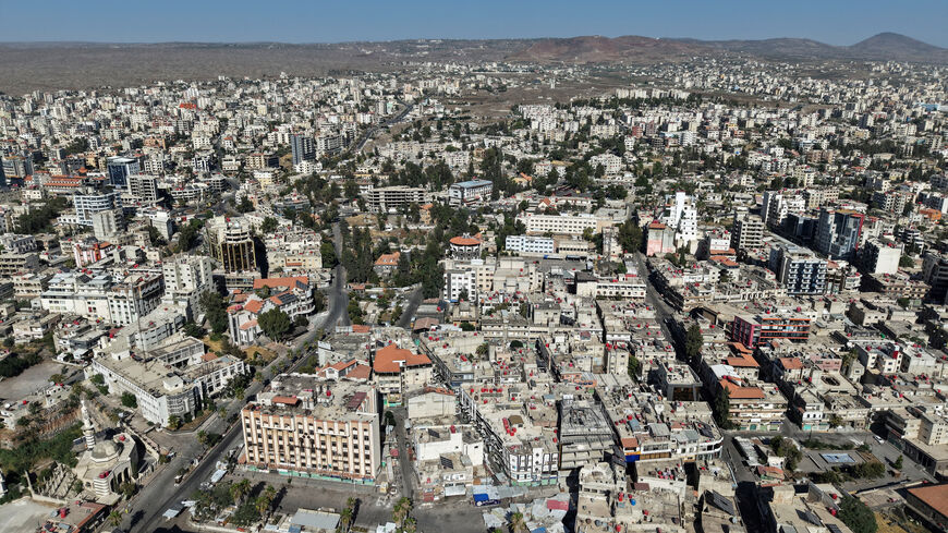 FILE PHOTO: A drone view shows the predominantly Druze city of Sweida, following deadly clashes between Druze fighters, Sunni Bedouin tribes and government forces, in Syria July 25, 2025. REUTERS/Khalil Ashawi/File Photo